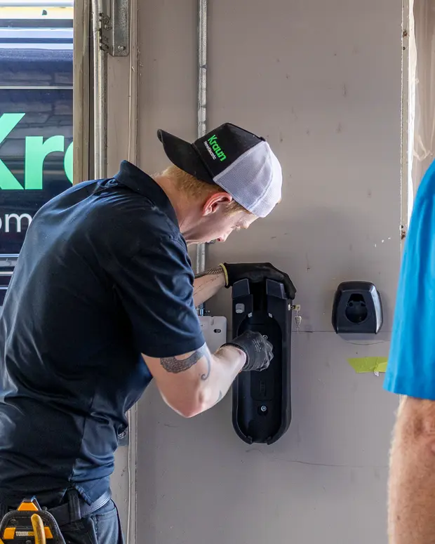 A Kraun electrician installing an EV charger