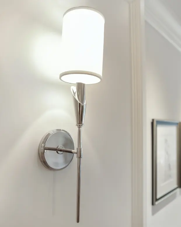 A wall sconce illuminating a room