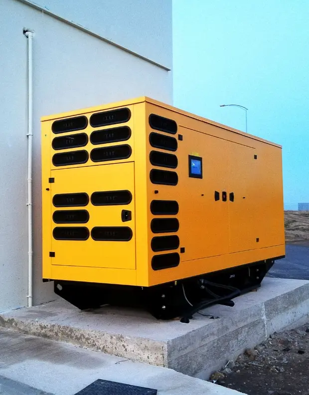 A commercial business backup generator installed outside
